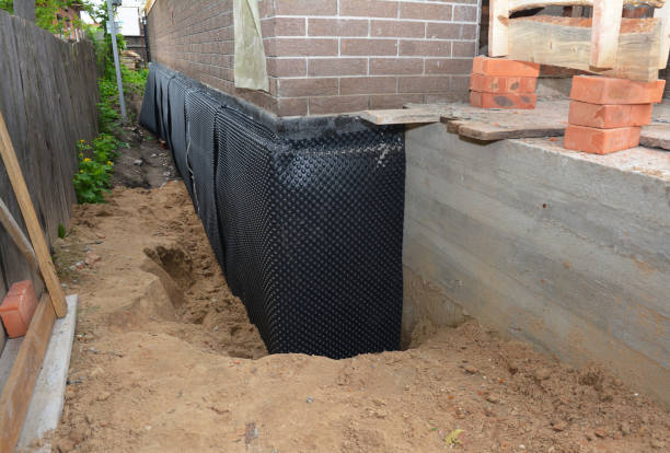 SJ Waterproofing Pros technician performing targeted Waterproofing assessment in Atmore, AL